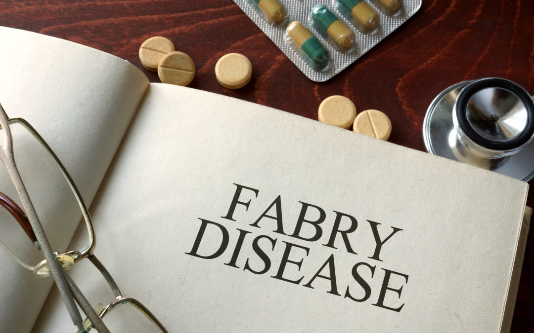 Book with diagnosis Fabry disease and pills. Medical concept.